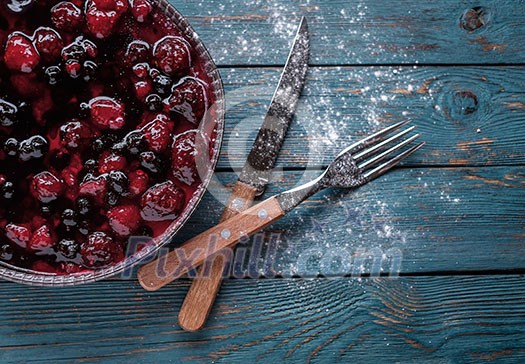 Berry pie on a wooden table.