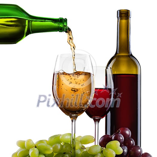 White wine pouring into glass with grape and bottles isolated