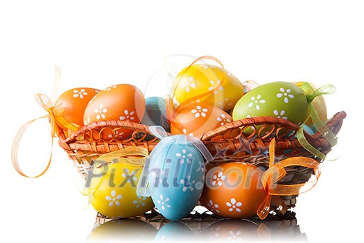 color easter eggs in basket isolated on white