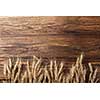 wheat on wooden background. top view