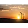 photo of wind generator turbines on sunset