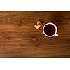 hot cup of tea with cookies on wooden table