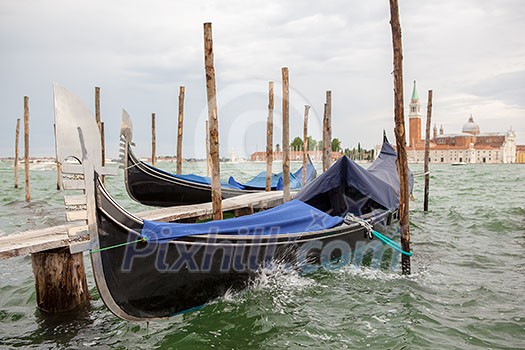 Gondolas and San Giorgio Maggiore church on Grand Canal in Venice Gondolas and San Giorgio Maggiore church on Grand Canal in Venice