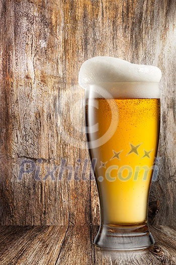 Glass of beer on wooden background Glass of beer on wooden background