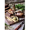 Baked spare ribs with herbs and spices. Wooden background. Rustic style.