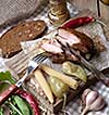 Baked spare ribs with herbs and spices. Wooden background. Rustic style.