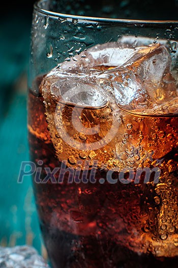 Glass of cola with ice. Close-up. Glass of cola with ice. Close-up.