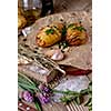 Sliced baked potatoes over wooden background. Rustic style.