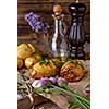 Sliced baked potatoes over wooden background. Rustic style.