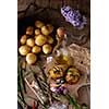 Sliced baked potatoes over wooden background. Rustic style.