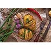 Sliced baked potatoes over wooden background. Rustic style.