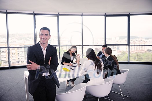 Group of happy young business people in a meeting at office Group of happy young business people in a meeting at office
