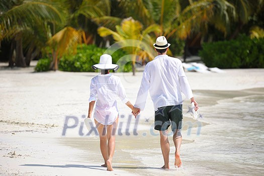 happy young romantic couple in love have fun running and relaxing on beautiful beach