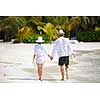 happy young romantic couple in love have fun running and relaxing on beautiful beach