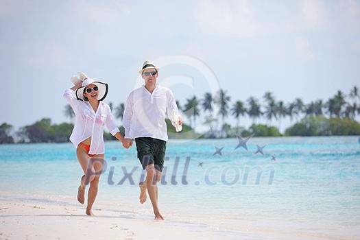 happy young romantic couple in love have fun running and relaxing on beautiful beach happy young romantic couple in love have fun running and relaxing on beautiful beach