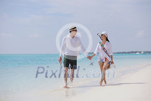 happy young romantic couple in love have fun running and relaxing on beautiful beach happy young romantic couple in love have fun running and relaxing on beautiful beach