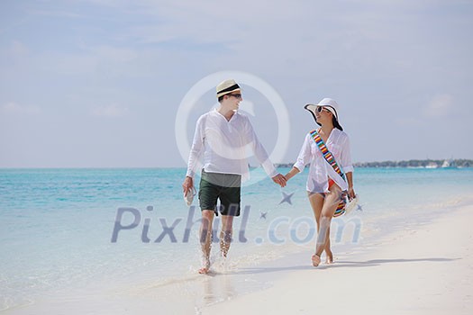 happy young romantic couple in love have fun running and relaxing on beautiful beach