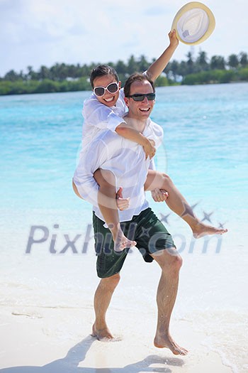 happy young romantic couple in love have fun running and relaxing on beautiful beach happy young romantic couple in love have fun running and relaxing on beautiful beach