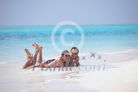 happy young romantic couple in love have fun running and relaxing on beautiful beach