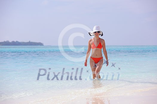 beautiful and happy woman girl on beach have fun and relax on summer vacation over the sea beautiful and happy woman girl on beach have fun and relax on summer vacation over the sea