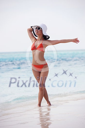 beautifel and happy woman girl on beach have fun and relax on summer vacation over the sea beautifel and happy woman girl on beach have fun and relax on summer vacation over the sea