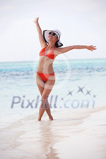 beautiful and happy woman girl on beach have fun and relax on summer vacation  over the sea