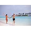 happy young romantic couple in love have fun running and relaxing on beautiful beach