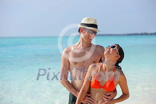 happy young romantic couple in love have fun running and relaxing on beautiful beach happy young romantic couple in love have fun running and relaxing on beautiful beach