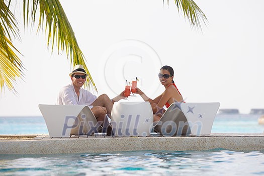 happy young couple relax and take fresh drink at summer vacation