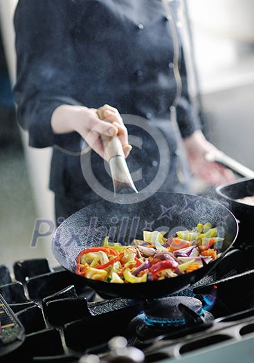 beautiful young chef woman prepare and decorating tasty food in kitchen