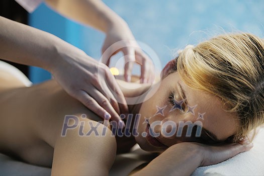 Beautiful young woman in spaand wellness. Face back and stone massage Beautiful young woman in spaand wellness. Face back and stone massage