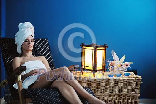 Beautiful young woman in spaand wellness. Face back and stone massage Beautiful young woman in spaand wellness. Face back and stone massage