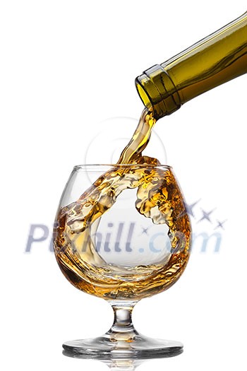 Cognac pouring into glass with splash isolated on white background Cognac pouring into glass with splash isolated on white background
