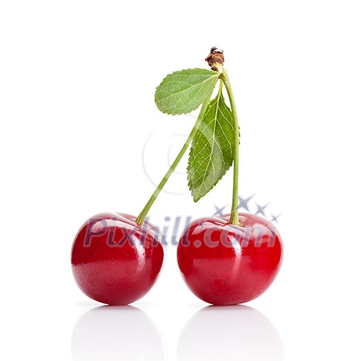 Red cherry with leaves isolated on white