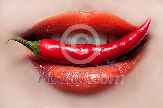Woman lips and chili pepper Woman lips and chili pepper