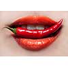 Woman lips and chili pepper