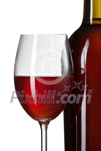 Glass of red wine and bottle on stump isolated on white