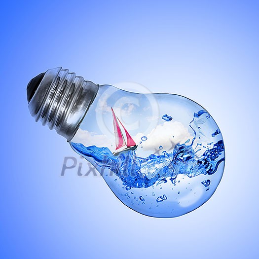 Energy concept. Light bulb with water and yacht inside isolated on white Energy concept. Light bulb with water and yacht inside isolated on white