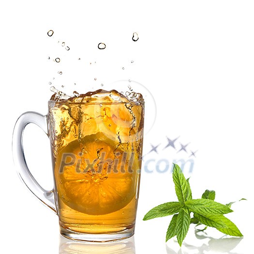 lemon dropped into tea cup with splash and mint isolated on white lemon dropped into tea cup with splash and mint isolated on white