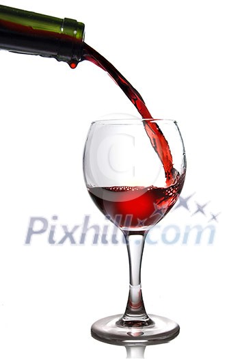 Pouring red wine in goblet