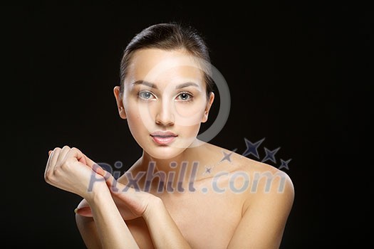 Beauty Portrait.  Perfect Fresh Skin. Isolated on Black Background. Pure Beauty Model. Youth and Skin Care Concept