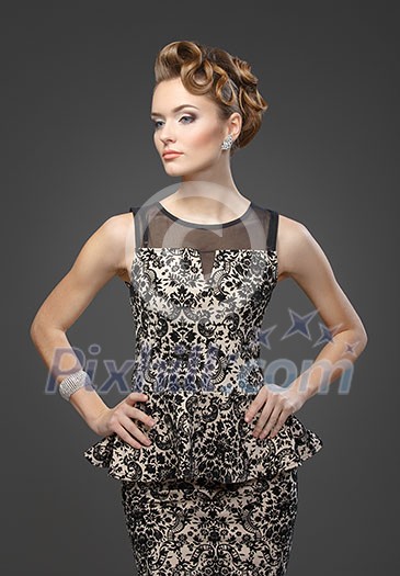Elegant woman with hairstyle on gray background. Elegant woman with hairstyle on gray background.