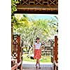 Woman getting spa treatment at tropical resort