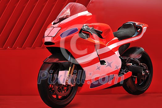 fast sport racing motorbike with copyspace and red background representing speed and power concept