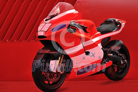 fast sport racing motorbike with copyspace and red background representing speed and power concept fast sport racing motorbike with copyspace and red background representing speed and power concept