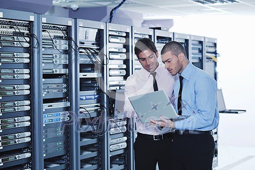 group of young business people it engineer in network server room solving problems and give help and support group of young business people it engineer in network server room solving problems and give help and support