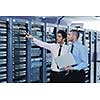 group of young business people it engineer in network server room solving problems and give help and support