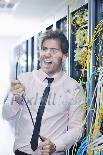 it business man in network server room have problems and looking for disaster situation solution it business man in network server room have problems and looking for disaster situation solution