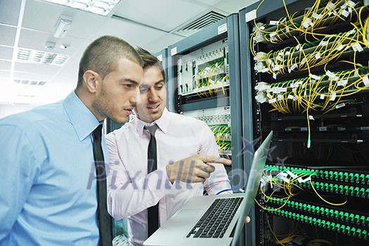 group of young business people it engineer in network server room solving problems and give help and support