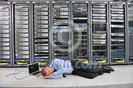 it business man in network server room have problems and looking for  disaster situation  solution